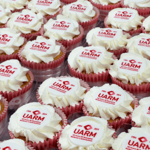 Branded frosted cupcakes in pink cases