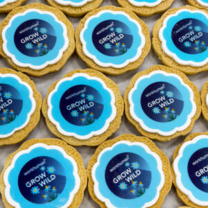 Flower shaped biscuit with a branded themed topper.