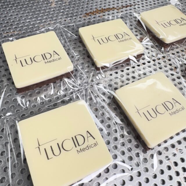 4cm chocolate squares with edible logo.